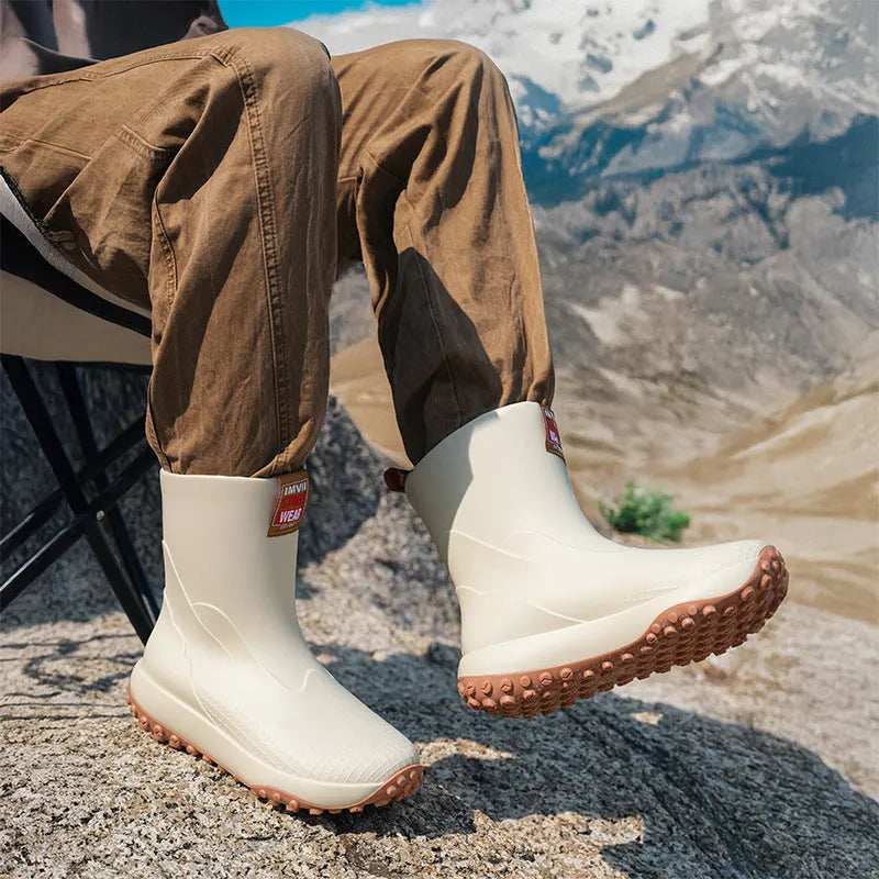 Men's mid low tube rain boots with non-slip sole and PVC upper in black