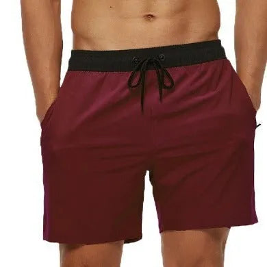 Men's blue running shorts with a drawstring waistband and a side headband pocket.