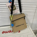 Simple all-match messenger bag design backpack in khaki with sewing line detail and adjustable crossbody strap