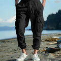 Men's loose fit linen casual trousers with ankle-tied tether and multiple pockets in an earthy colour.