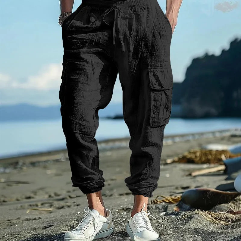 Men's loose fit linen casual trousers with ankle-tied tether and multiple pockets in an earthy colour.