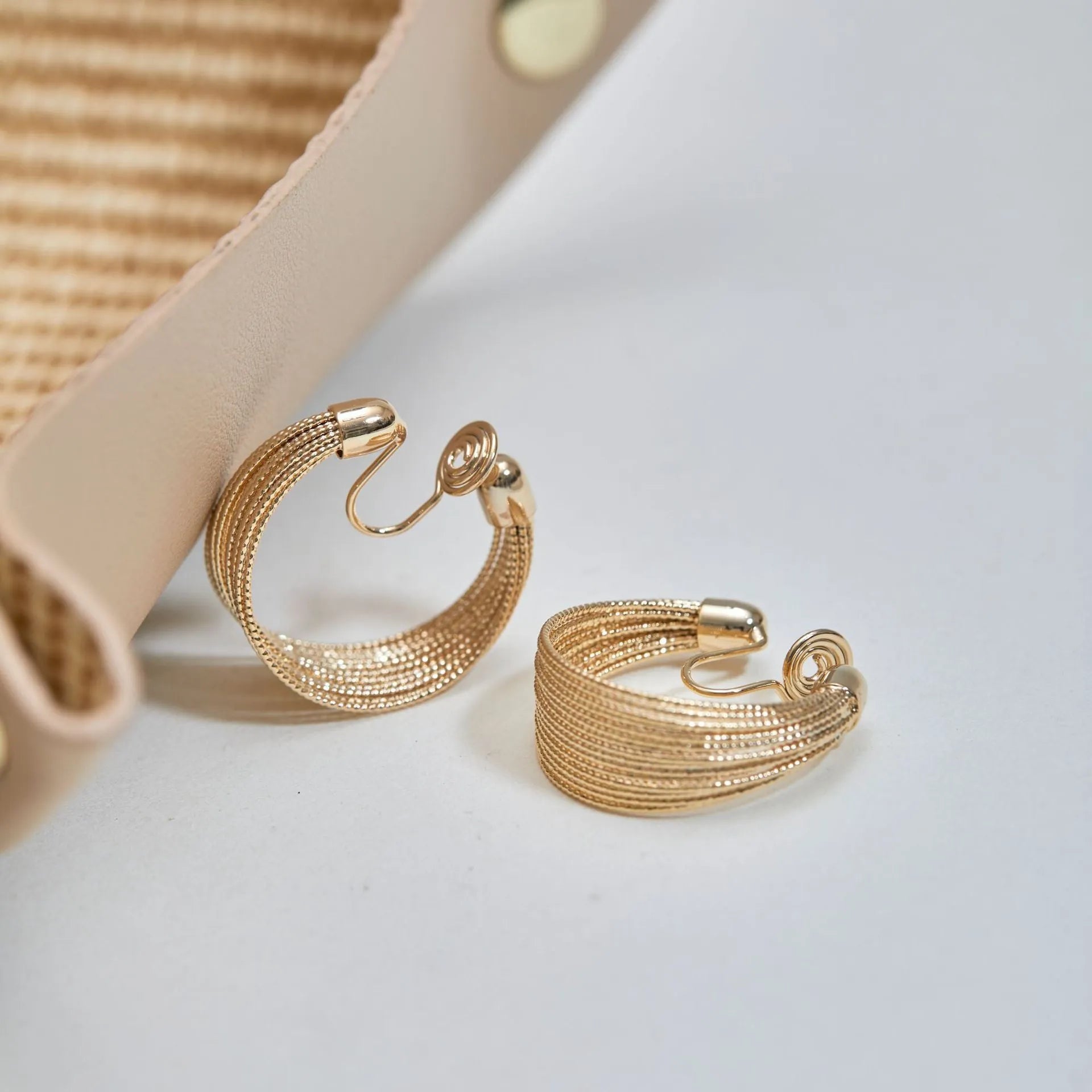 Copper geometric bracelet earrings set showing silver and gold electroplated stud and clip earring pairs