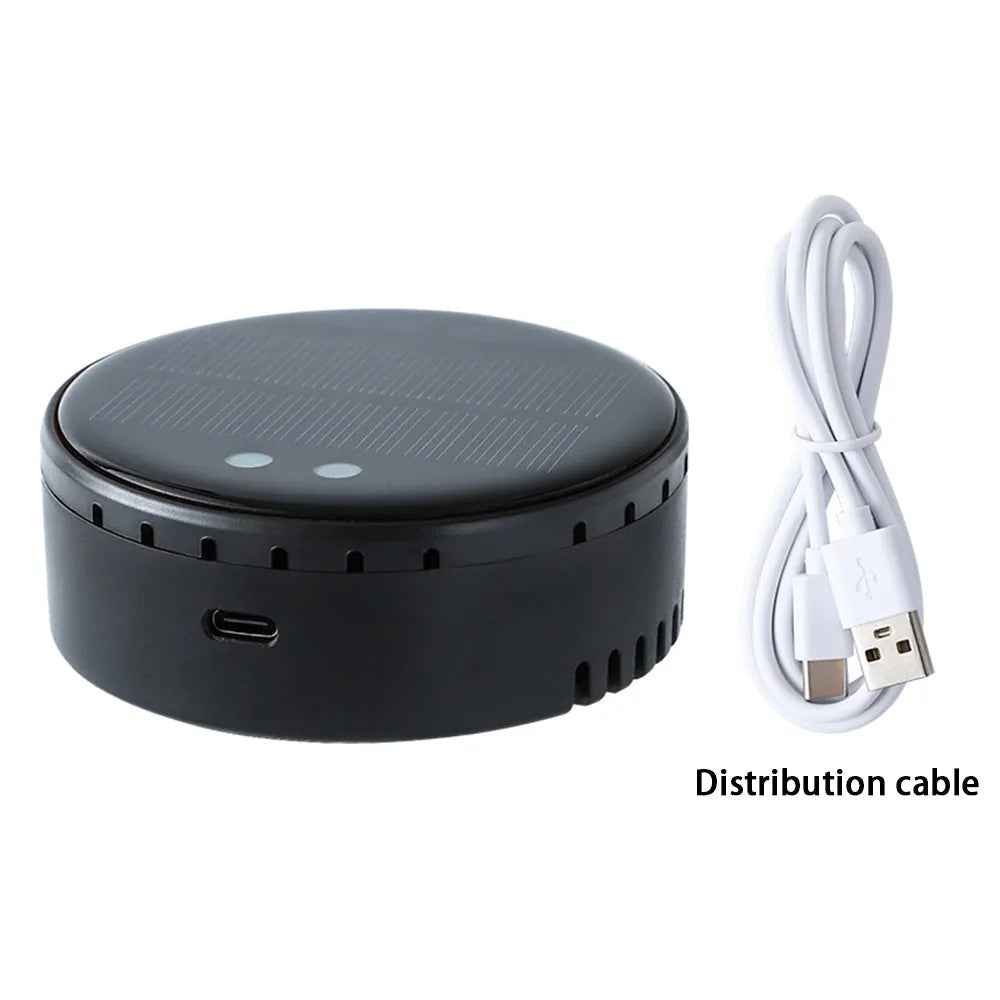 Black solar-powered car air humidifier mounted on a car air vent