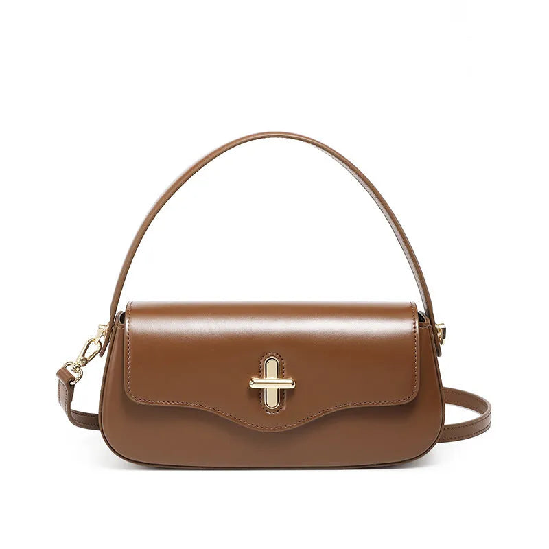 Genuine leather baguette handbag in black with clamshell opening and lock detail