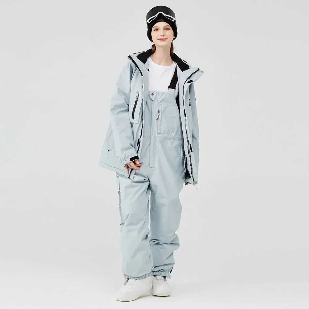 Unisex waterproof ski suit in blue top with black pants for winter snow sports
