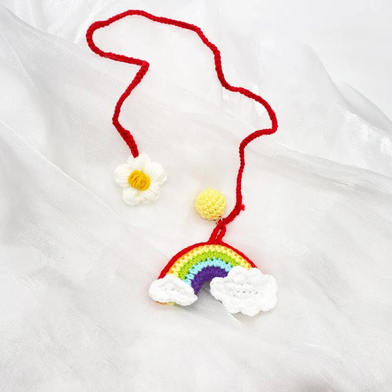 Handmade wool crocheted car pendant in avocado, pink rainbow, and red rainbow colour options