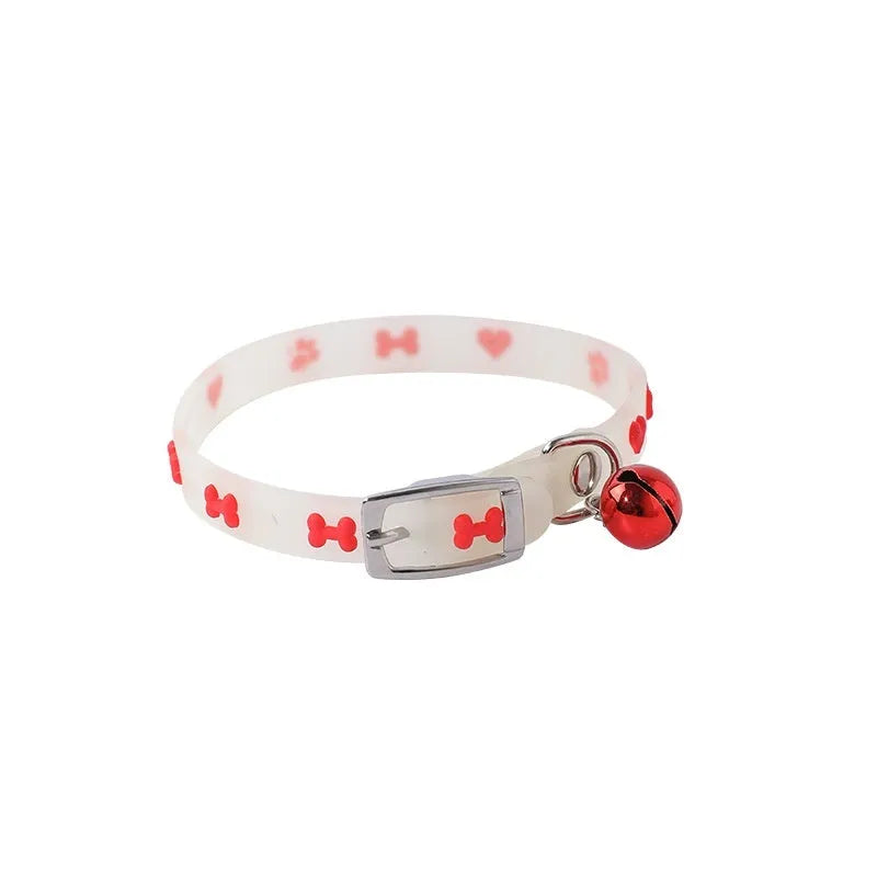 Cat wearing luminous collar with silicone chain and metal bell in paw print style