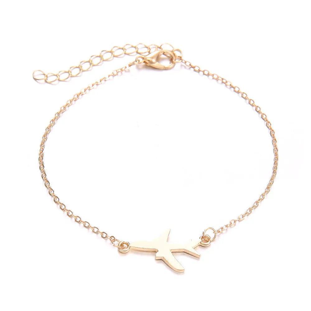 Three identical women's alloy charm bracelets with heart-shaped aircraft map charm on a white background.