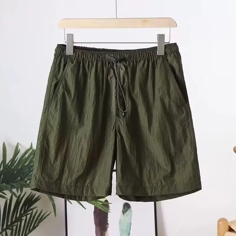Men's quick-drying polyester blend sports shorts in blue with straight leg, available in multiple sizes