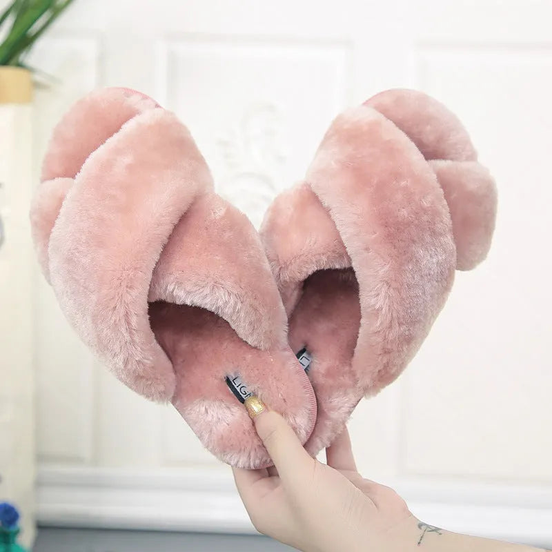 Women's black cross open-toe fur slippers with a textured non-slip rubber sole.