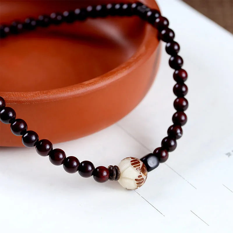 Natural rosewood double-ring bracelet with hand-knitted construction and flower-shaped beads