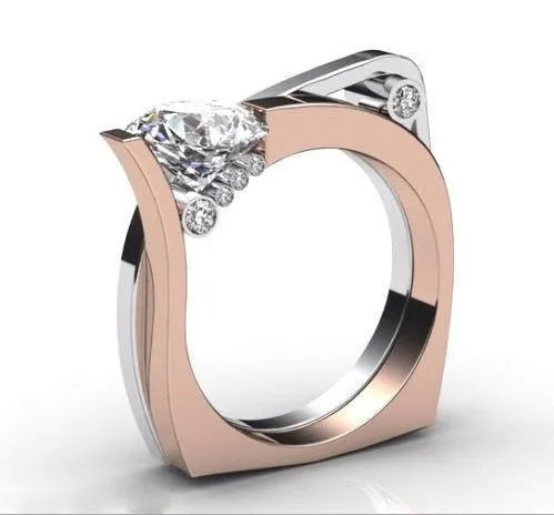 Rose gold geometric women's ring with zircon detail on a grey background.