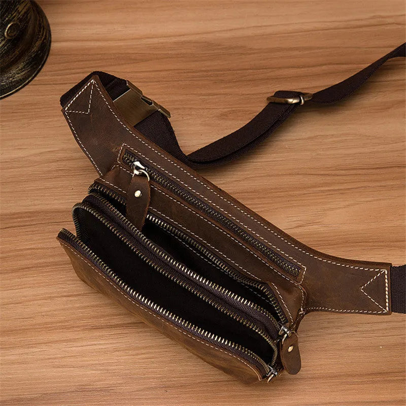 Brown top layer cow leather men's sports waist bag with a zip closure.