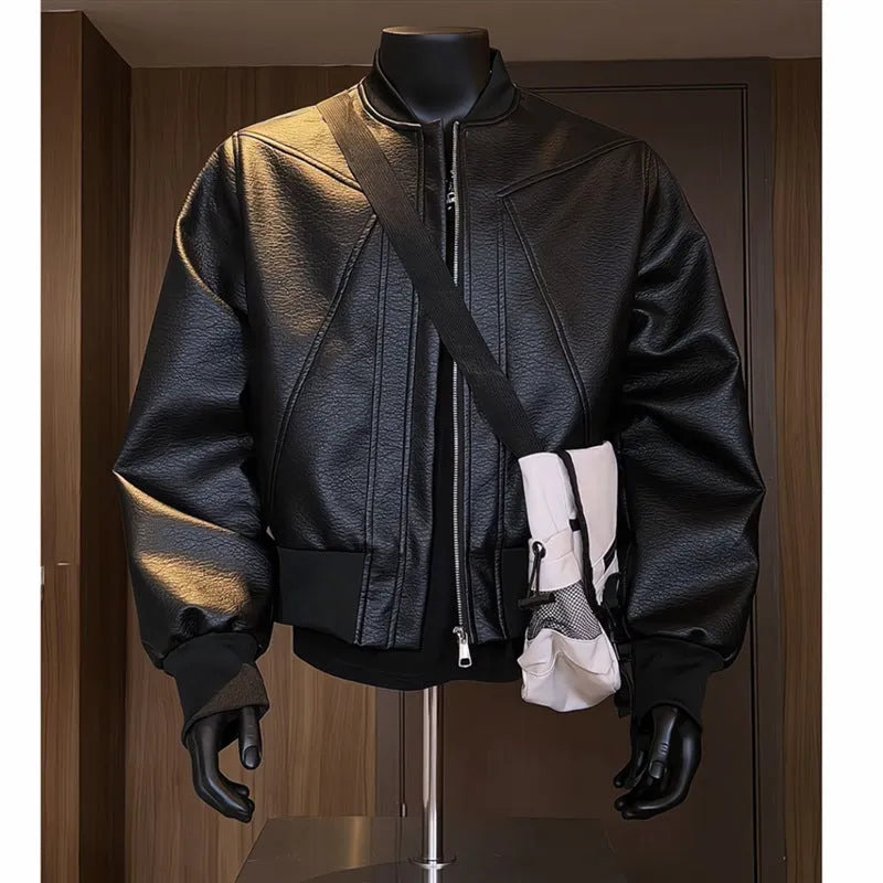 Man wearing a black slim-fit PU leather jacket with litchi pattern texture and extended 100cm length