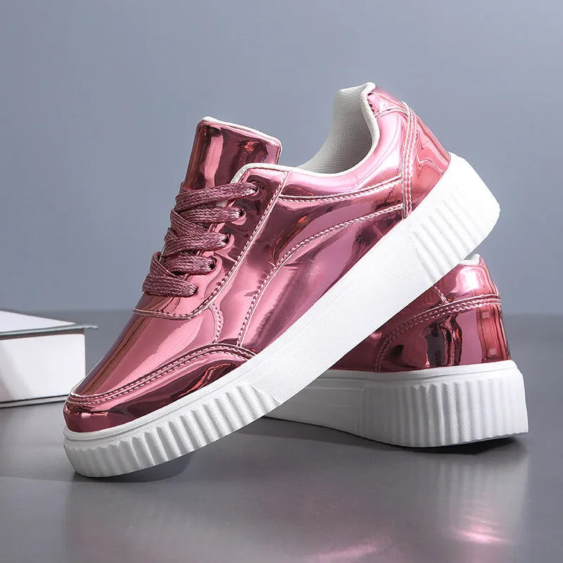 Gold sequined platform sneakers with round toe and thick MD sole on a white background.