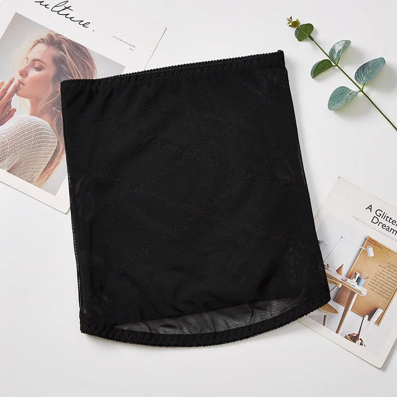 Black mesh postpartum belly band for waist trimming and tummy slimming laid flat.