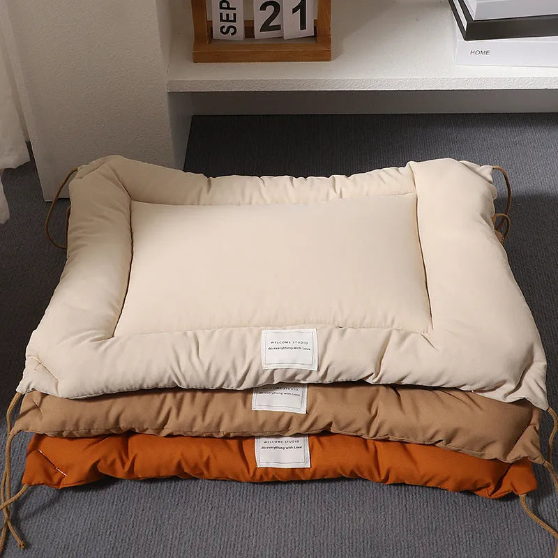 Tied cage cushion for dogs and cats in beige, showing platform attached to wire crate bars – size L.