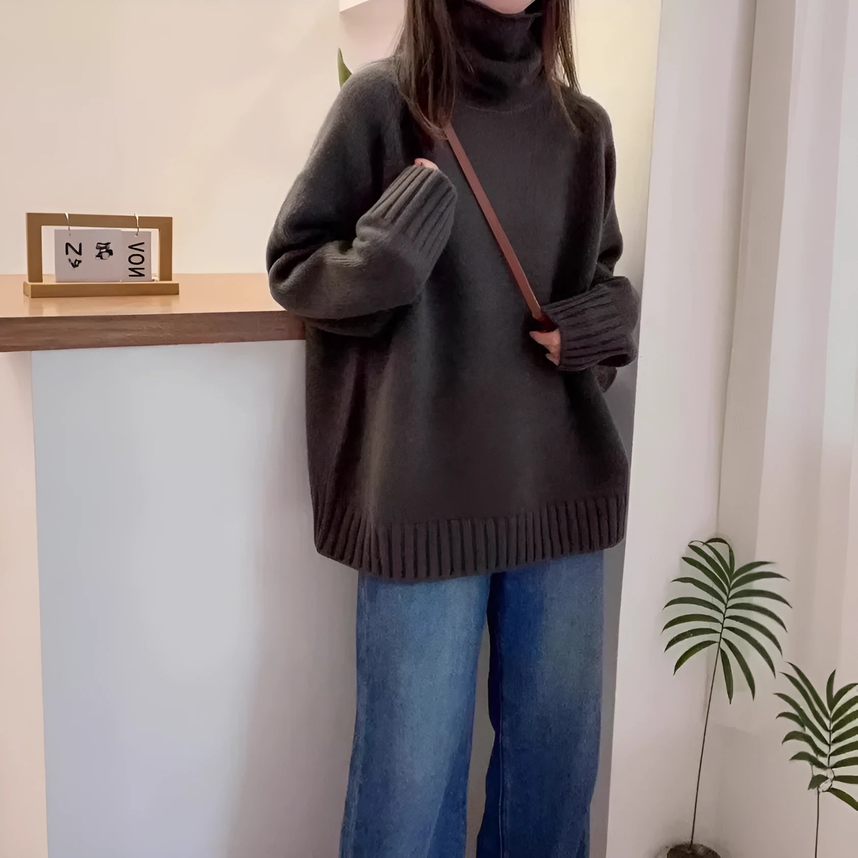 Women's loose thick turtleneck sweater with textured curling pile collar in solid colour