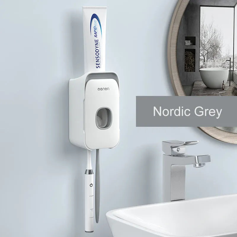 Automatic toothpaste dispenser in blue, grey, and pink colours made from ABS plastic.
