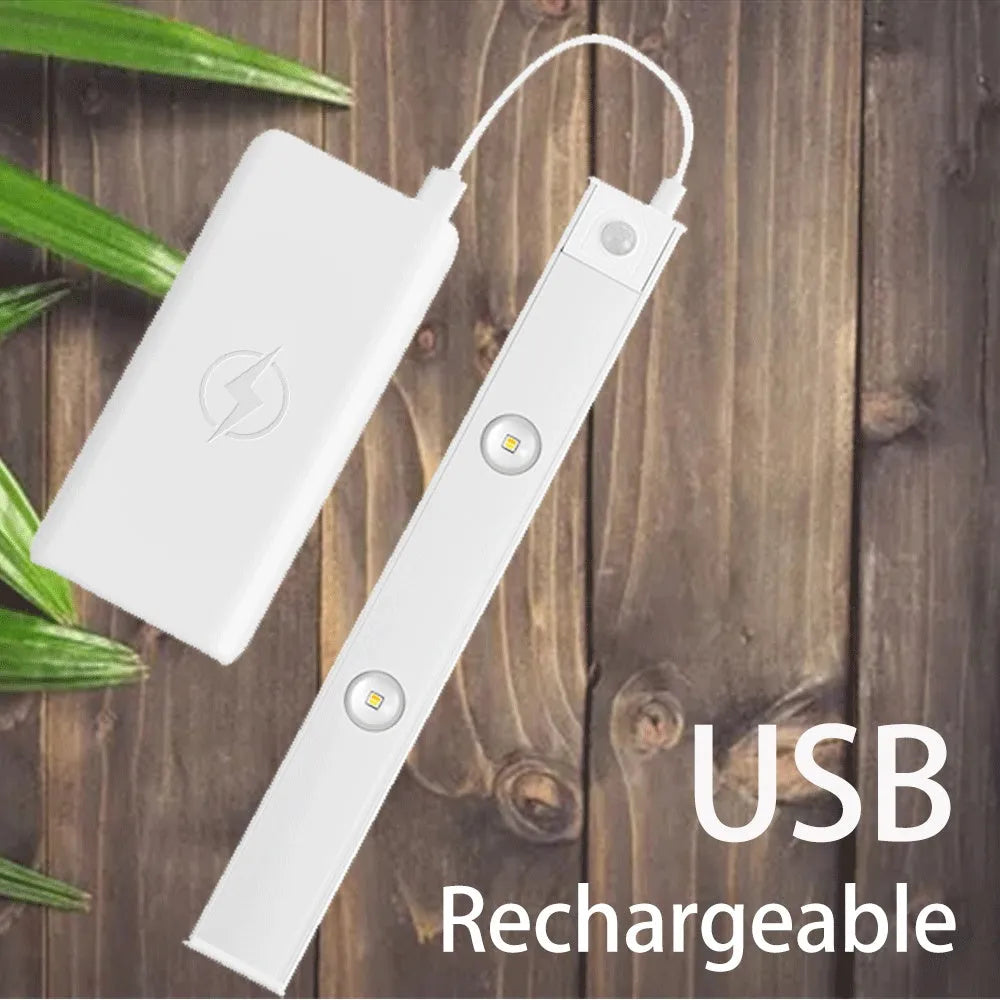 Ultra-thin USB LED night light with motion sensor in silver, aluminium body, 20 cm length, mounted inside a kitchen cabinet