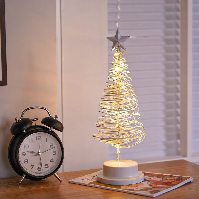 LED Christmas tree spiral light ornament in iron, golden finish, 33cm tall, warm white glow on a tabletop