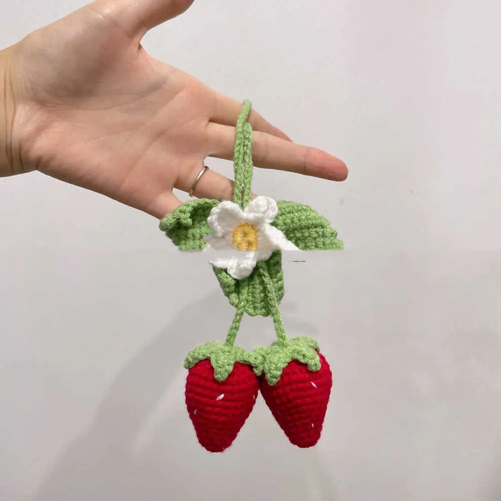 Handmade strawberry-shaped car pendant knitted from cotton and hemp fibres