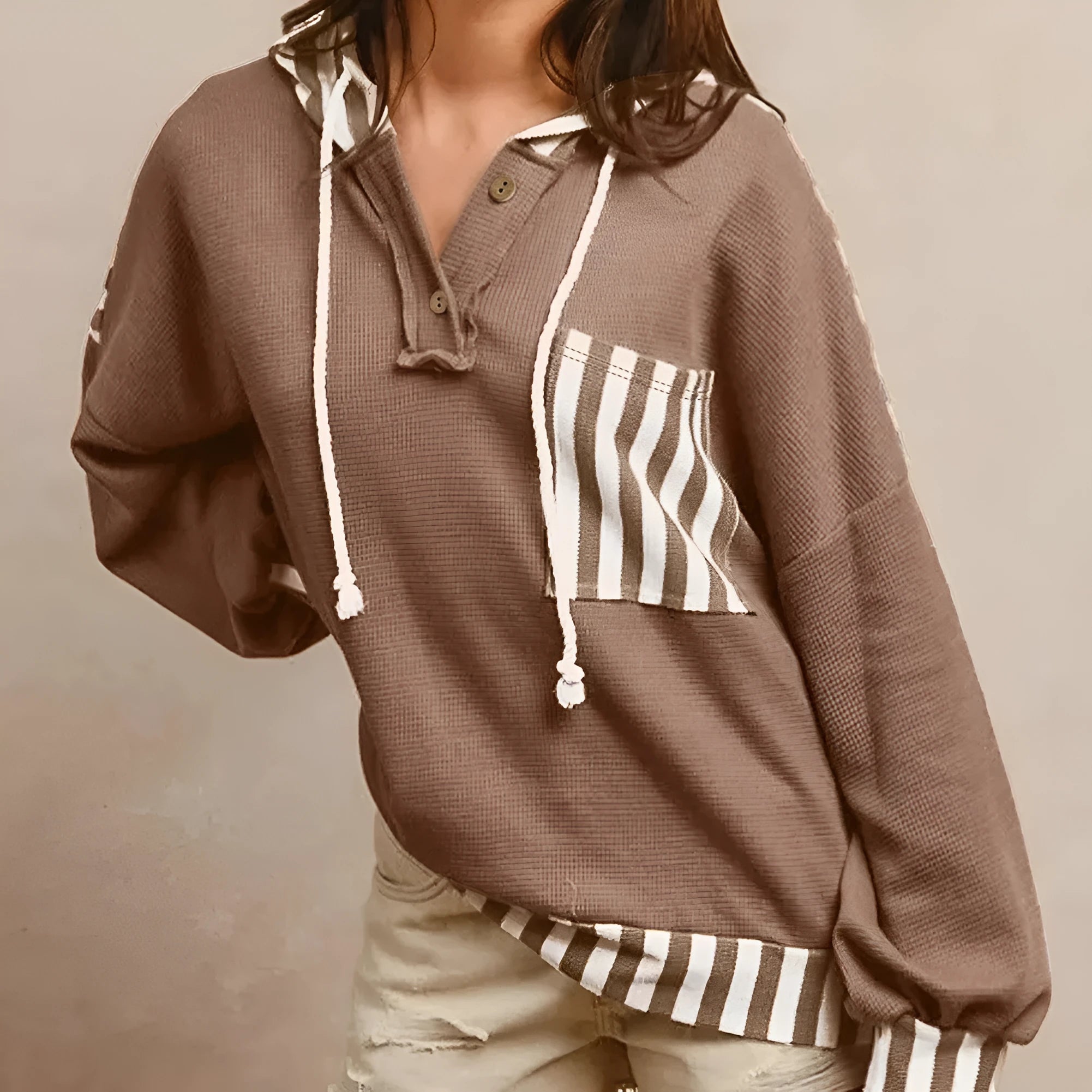 Straw yellow women's hoodie with waffle texture, patchwork stripes, a drawstring hood, and button neck.