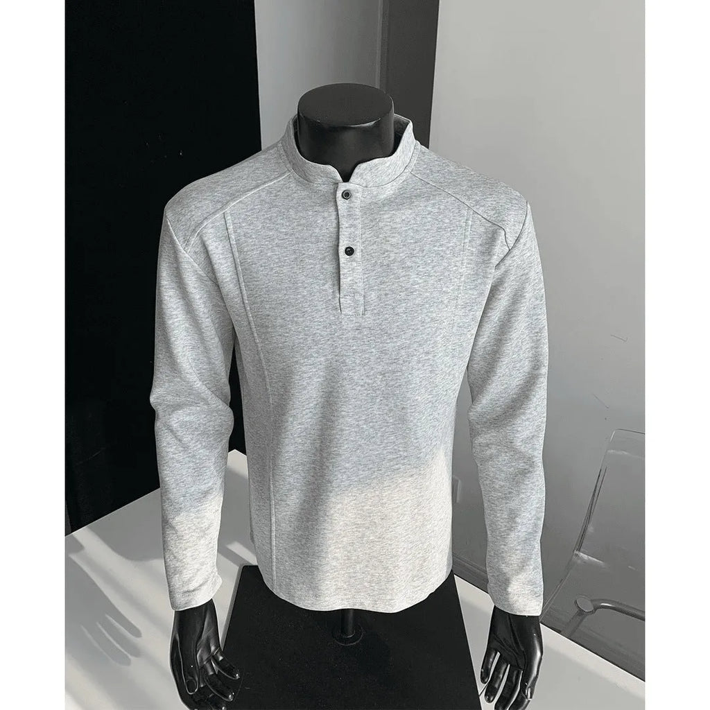 Man wearing a grey patchwork stand-up collar polo shirt with asymmetric shoulder detail