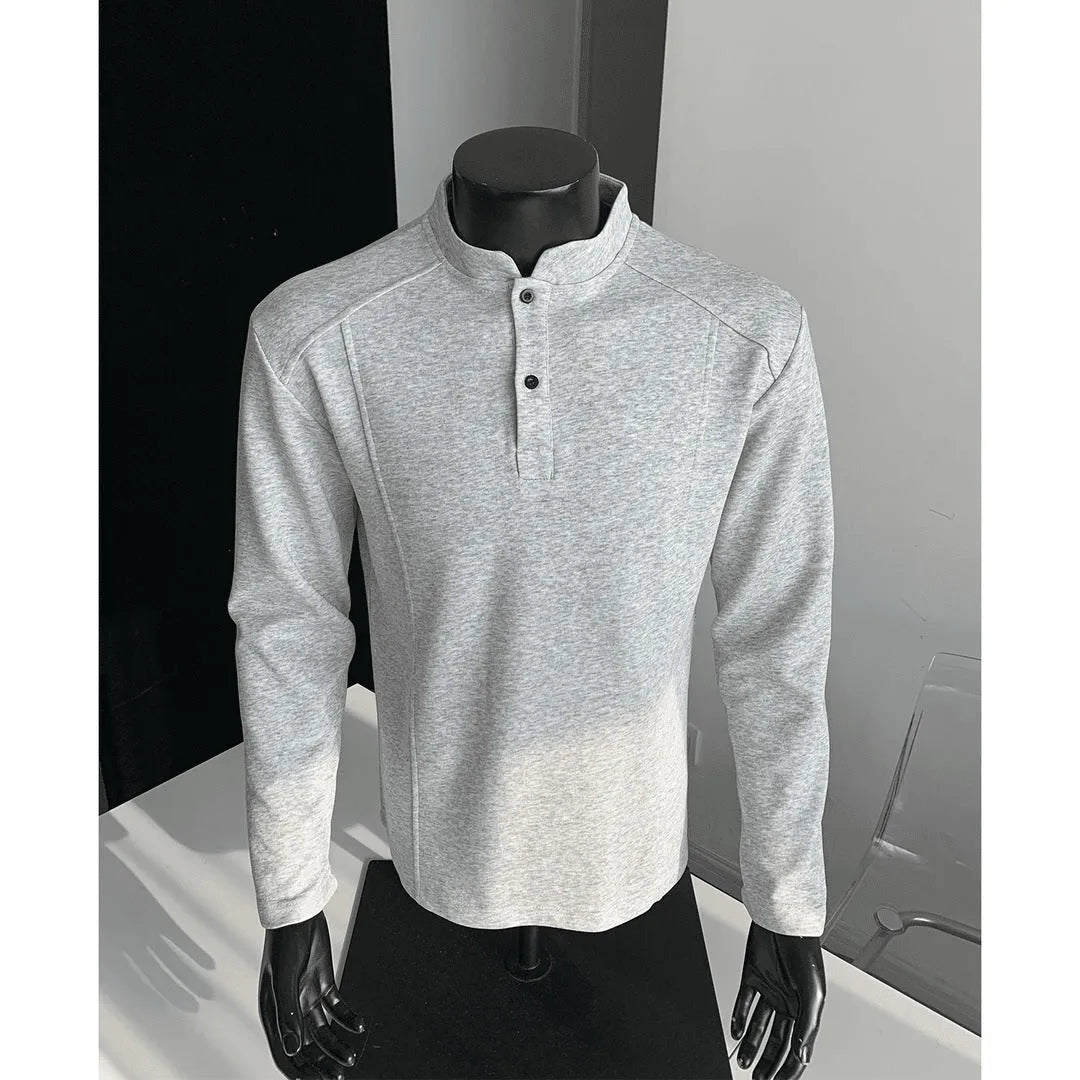 Man wearing a grey patchwork stand-up collar polo shirt with asymmetric shoulder detail
