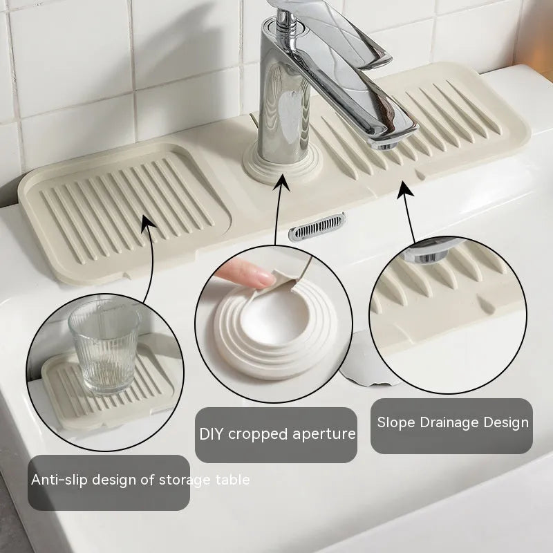 Silicone faucet pad with sloped surface and two drains in beige colour on a kitchen sink