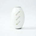 Green and white reusable gel lint roller ball for pet hair removal from clothes and furniture