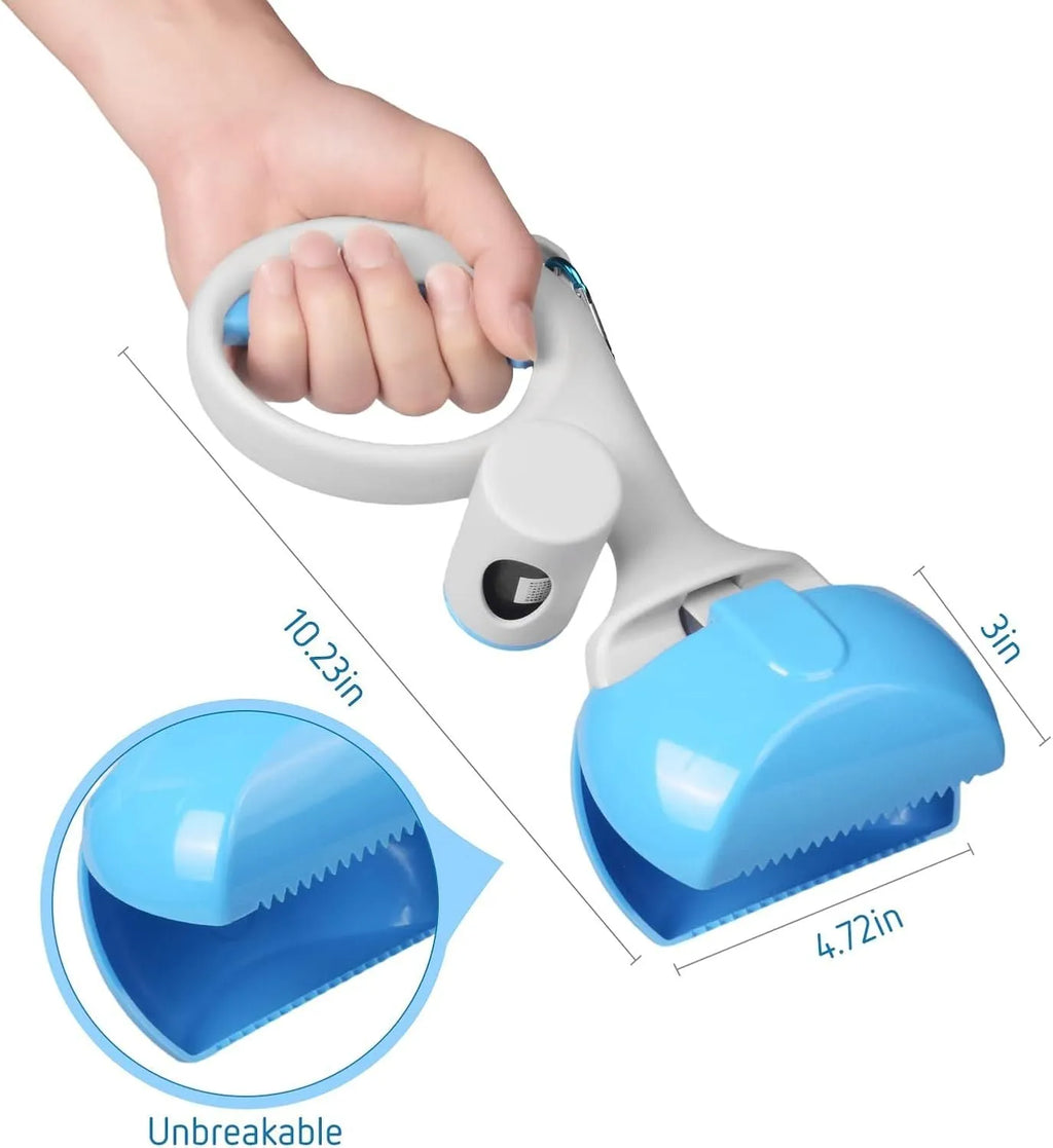 Black pet pooper scooper with built-in bag holder and top carry hook on a grassy background.