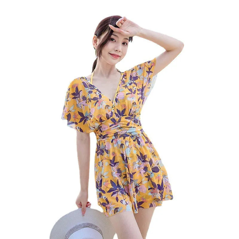 Women's yellow floral one-piece swimsuit made from polyester with full coverage design