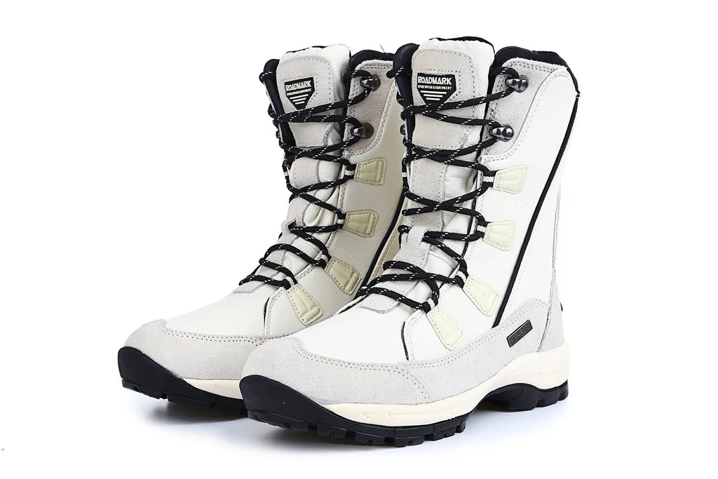 Women's black waterproof thermal snow boots with a genuine leather upper and mid-calf height