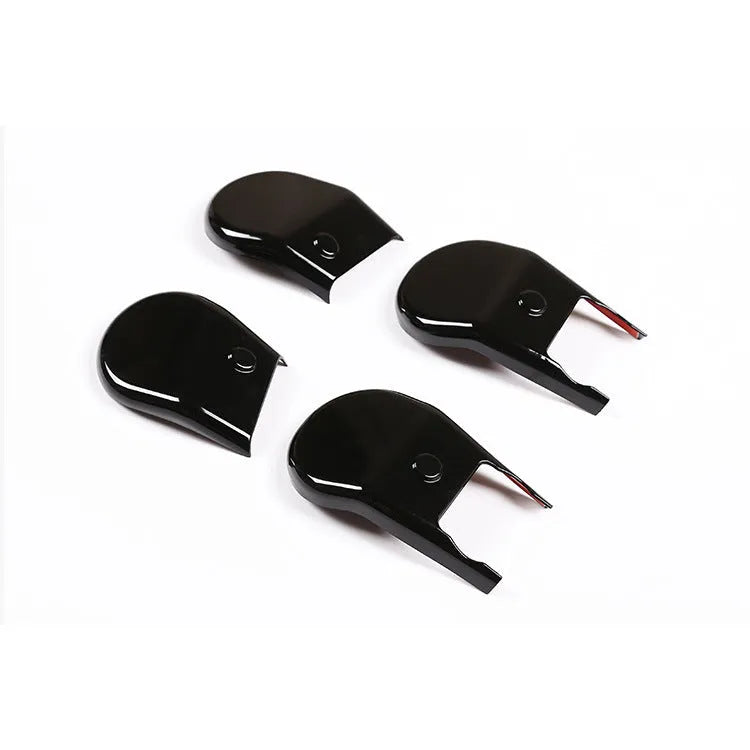 Black plastic seat feet screw decoration covers for 15-21 Toyota Hi Lux, 4 piece set on a white background