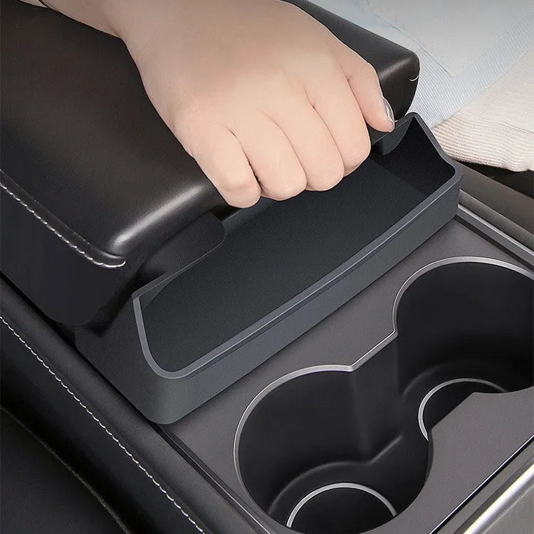 Black silicone car glasses case attached to Tesla Model 3 armrest box for sunglasses storage