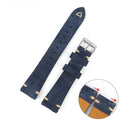 Brown genuine suede leather watch strap showing textured surface and buckle, laid flat.
