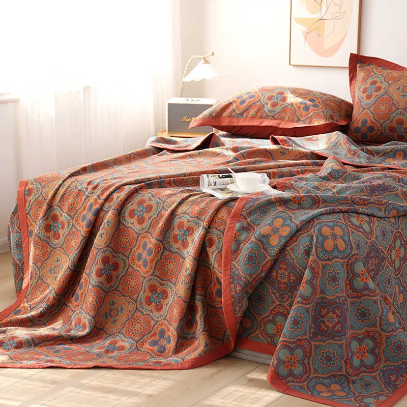 Three-piece cotton gauze bed blanket set with floral pattern showing blanket and two pillowcases