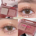 Two-tone eyeshadow plate showing five colour combinations including pink, brown, blue and black matte shimmer shades
