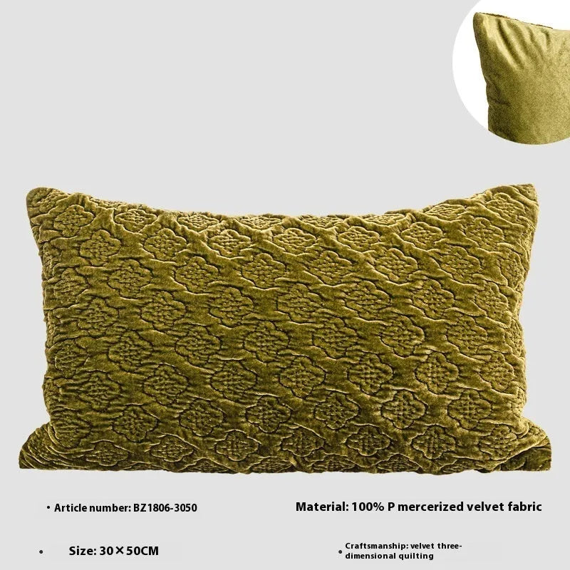 Brown gold antique-style quilted square cushion pillow with three-dimensional texture on a chair.