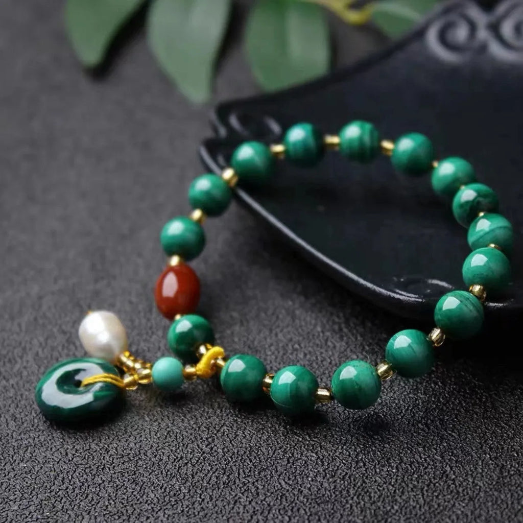 Natural green malachite and red agate barrel bead bracelet measuring 7-8mm with handcrafted unisex design
