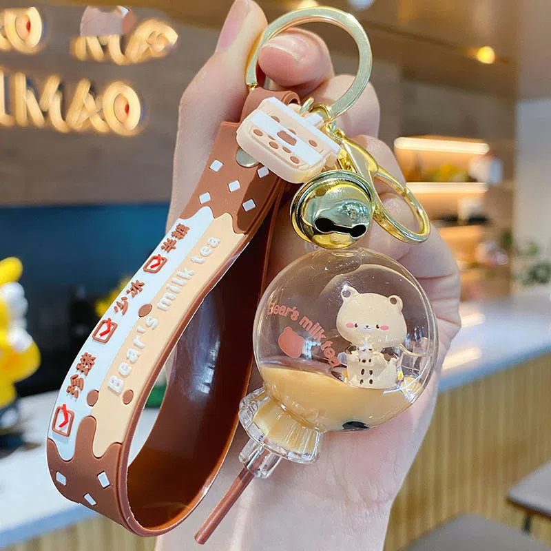 Oil-infused pearl milk tea bear acrylic keychain pendant in drink bottle style with visible liquid and floating pearls