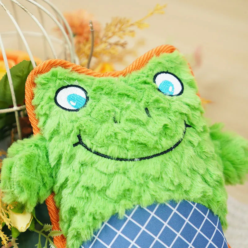 Blue bite resistant plush puppy toy with squeaker on plain background