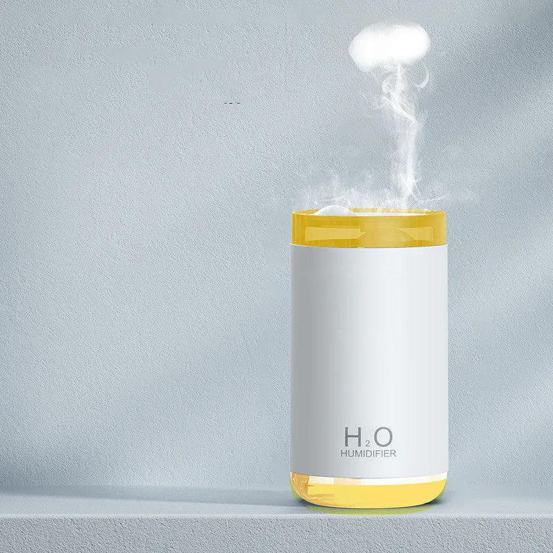 USB jellyfish humidifier creating smoke ring mist patterns with warm night light illumination