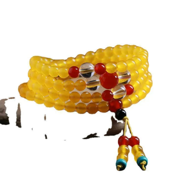 108-bead polished agate and crystal necklace with geometric beads and matching canary stone bracelet on display