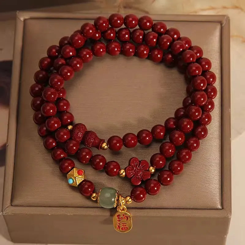Polished cinnabar gourd five petal flower bracelet 6mm multi-circle on display
