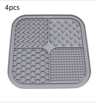 Green silicone pet licking pad 20x20cm with suction cup base on a tiled floor