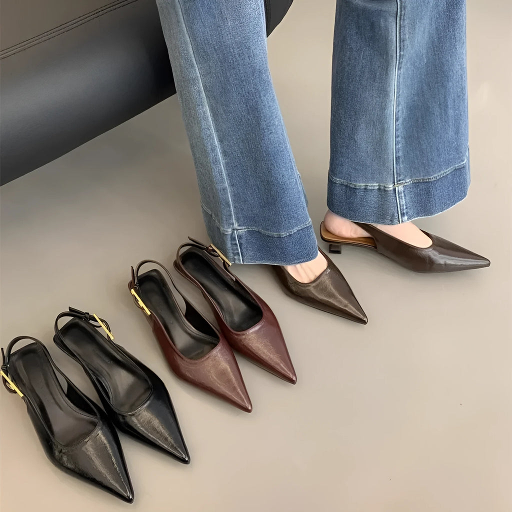 Thin low heel strap pointed leather shoes for women, black colour, side view showing heel height and ankle strap