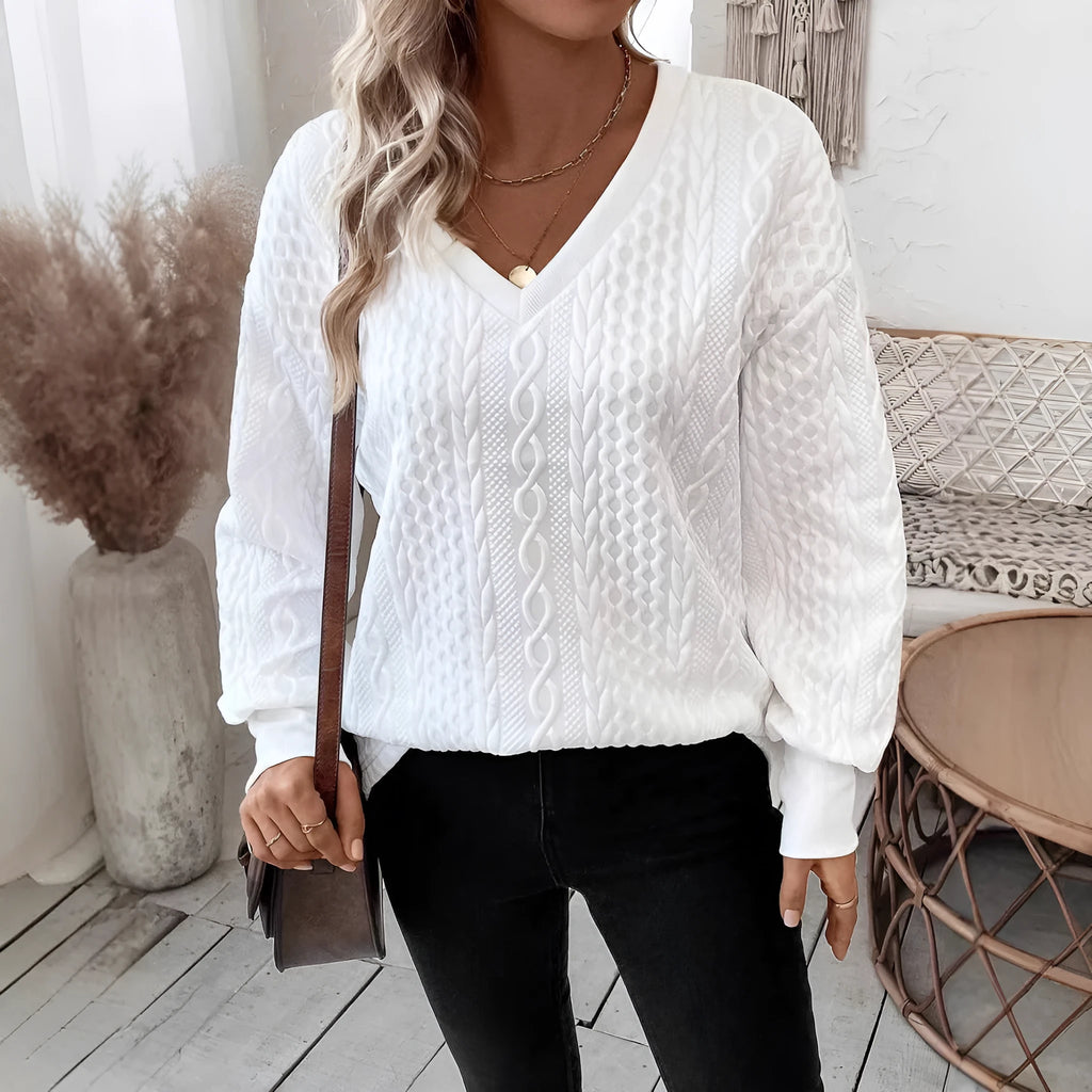 Milk white loose fit long sleeve t-shirt with a subtle 3D pattern on a casual model