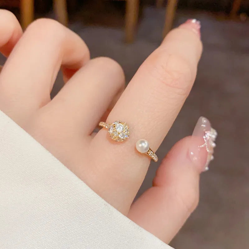Women's gold plated open-end pearl ring with round zircon geometric design on copper base